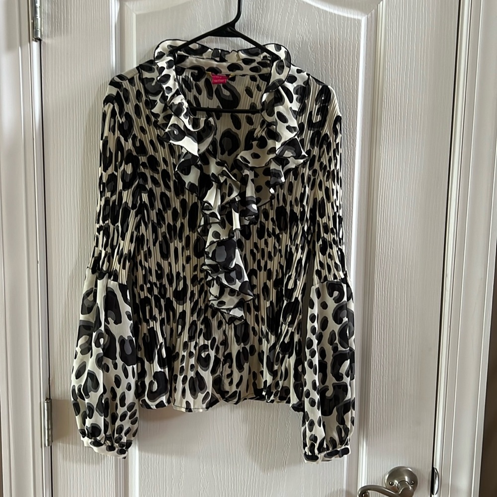 Sunny Leigh top. Pleated bodice and partially pleated bell sleeves.